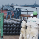 Truck loaded with poles